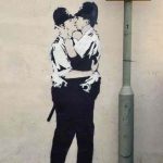 Banksy kissing policemen